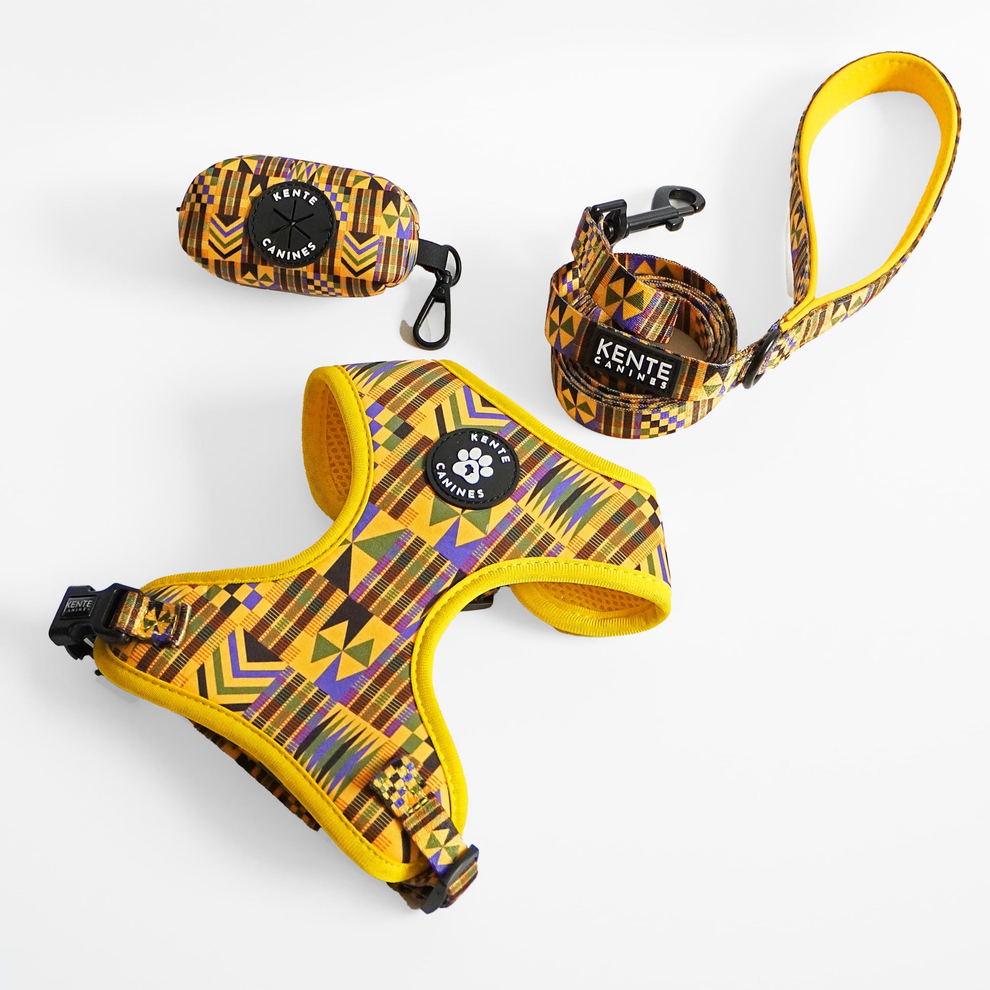 Kente Canines Gold Rush Dog harness, leash, and collar set with Kente pattern on a white background