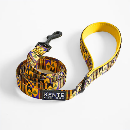 Kente Canines Gold Rush yellow leash with Kente pattern on a white background