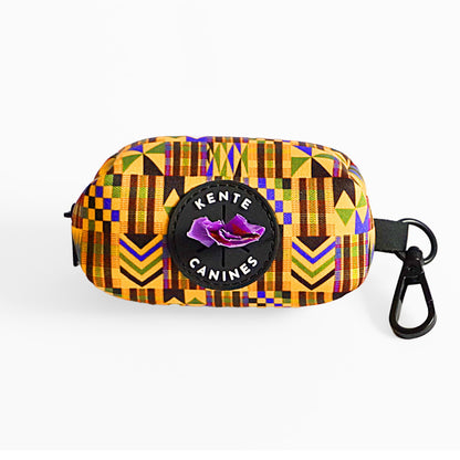 Kente Canines Gold Rush Colorful geometric-patterned poop bag pouch dispenser with a carabiner and bag on a white background